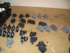 Raw models, some primed, some not, none cleaned of flash and