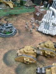 Ravenite Tanks flanked by Necron Monolith