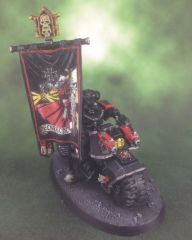 Ancient on bike with Chapter banner